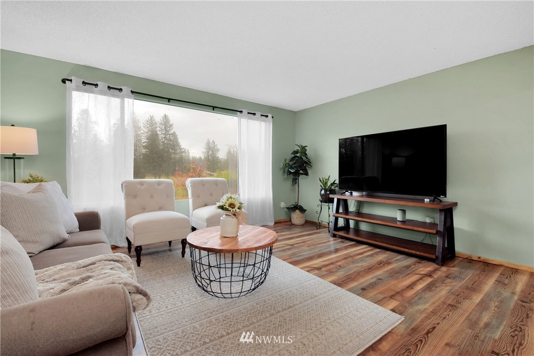 35704 Reese Road Sultan, WA 98294 - Photo 5 of 35 a living room with furniture and a flat screen tv