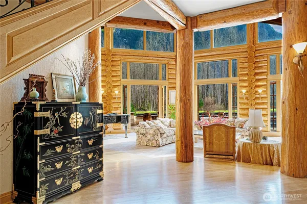 a bedroom with furniture and wooden floor