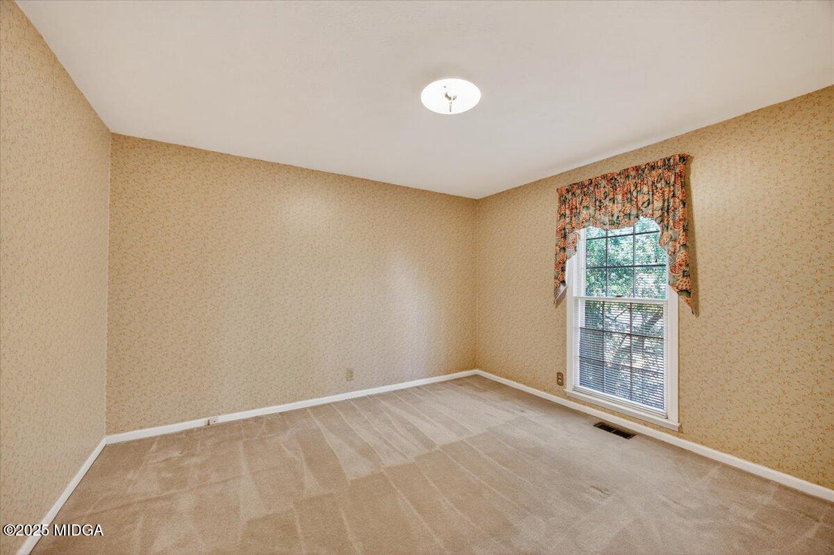 673 Commanche Drive Macon, GA 31210 - Photo 23 of 40 a view of an empty room with a window