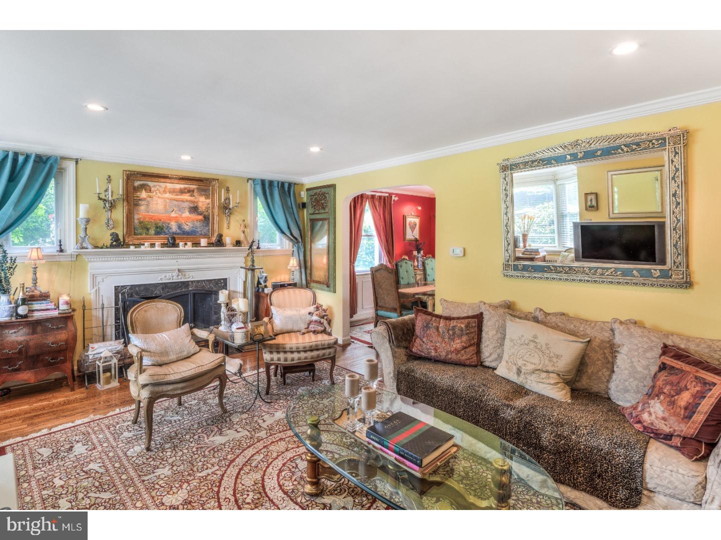 415 Earlington Road Havertown, PA 19083 - Photo 2 of 22 a living room with furniture and a fireplace