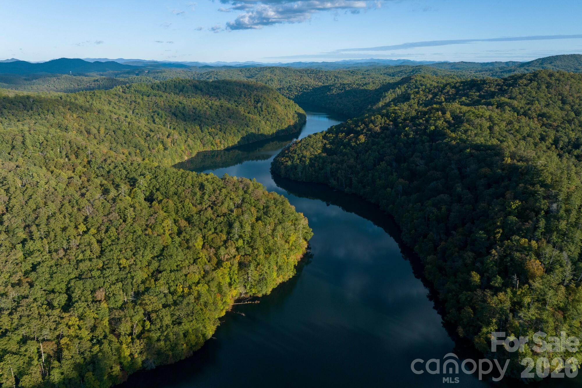 2108 River Hill Road Murphy, NC 28906 - Photo 14 of 31 a view of a lake with a mountain in the background