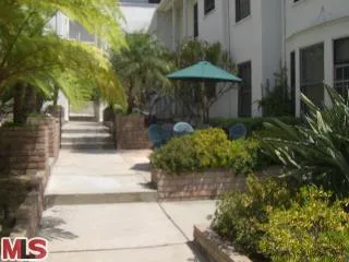 a view of a pathway with an umbrella