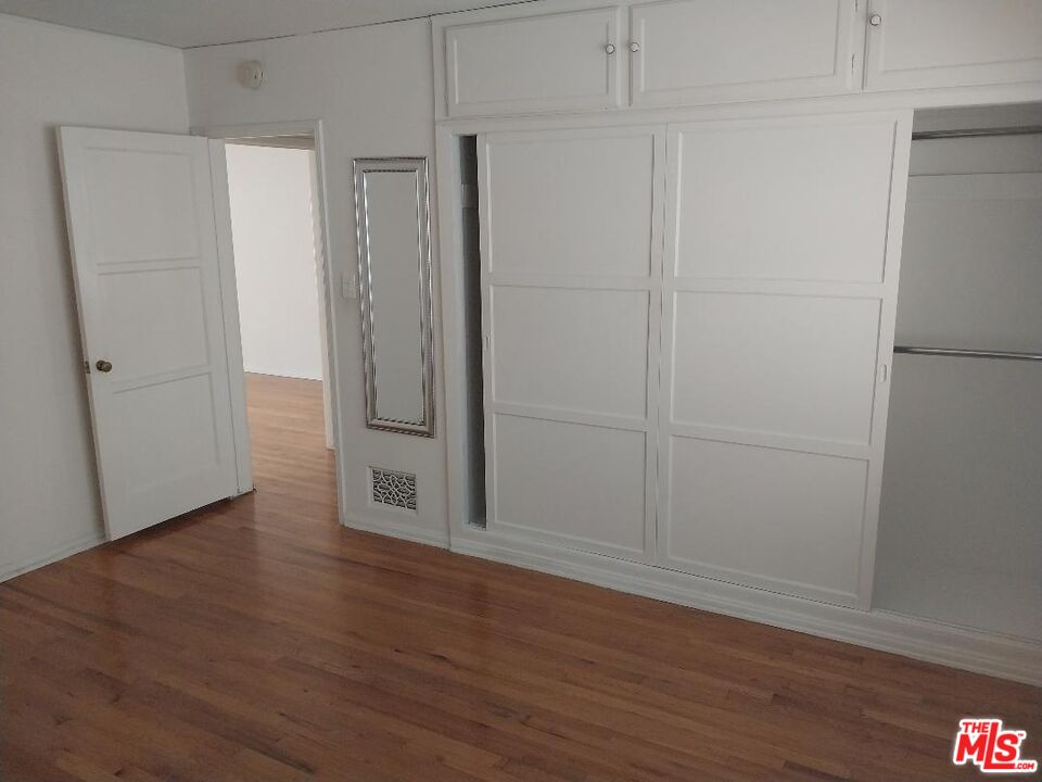 8559 Holloway Drive, Unit 2 West Hollywood, CA 90069 - Photo 4 of 10 a view of wooden floor and closet in a room