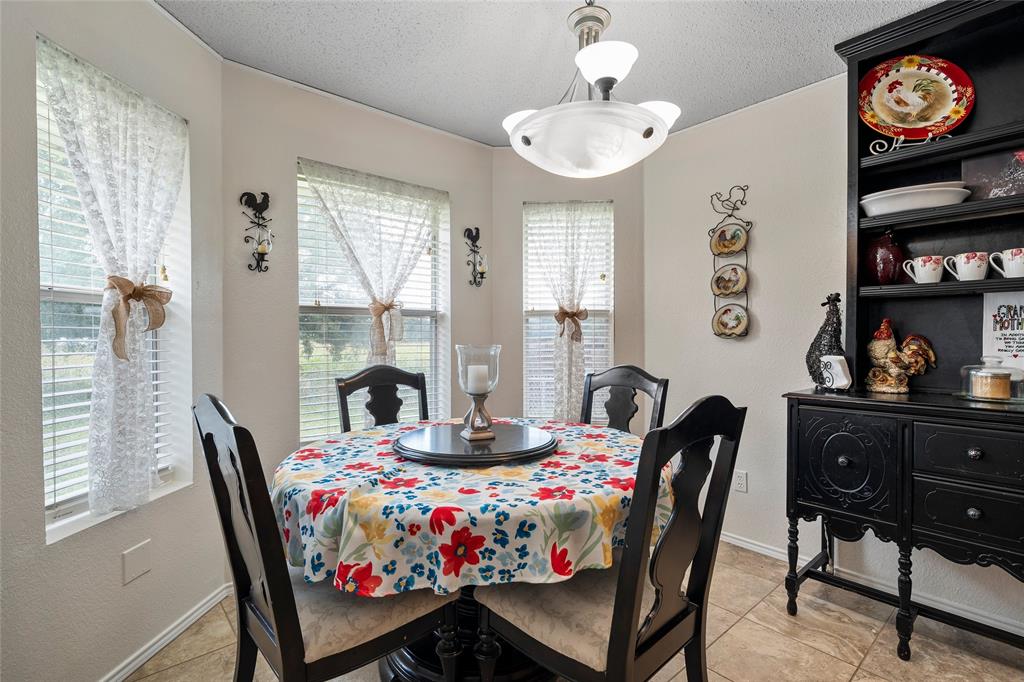 4617 Lexington Street Waco, TX 76705 - Photo 7 of 14 Dining area featuring light-toned walls and tile flooring