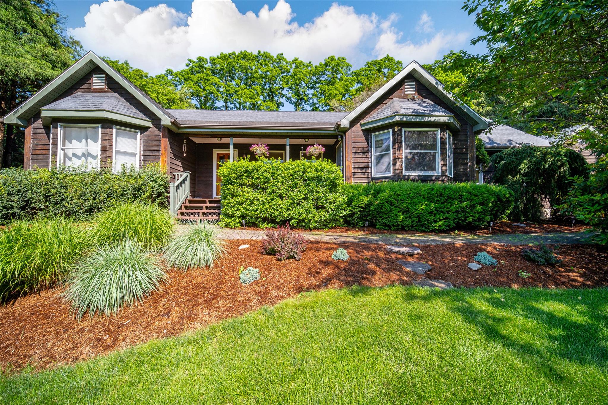 a front view of a house with a yard