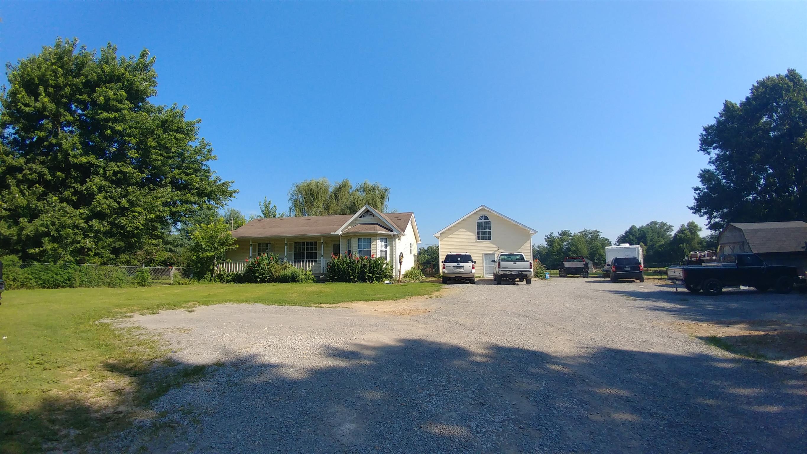 307 Butler Road Portland, TN 37148 - Photo 1 of 21 a view of a house with a yard and large trees