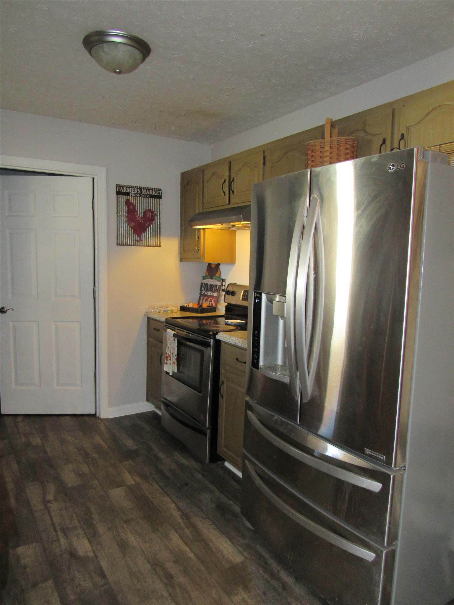 307 Butler Road Portland, TN 37148 - Photo 13 of 21 a kitchen with stainless steel appliances granite countertop a refrigerator and a stove