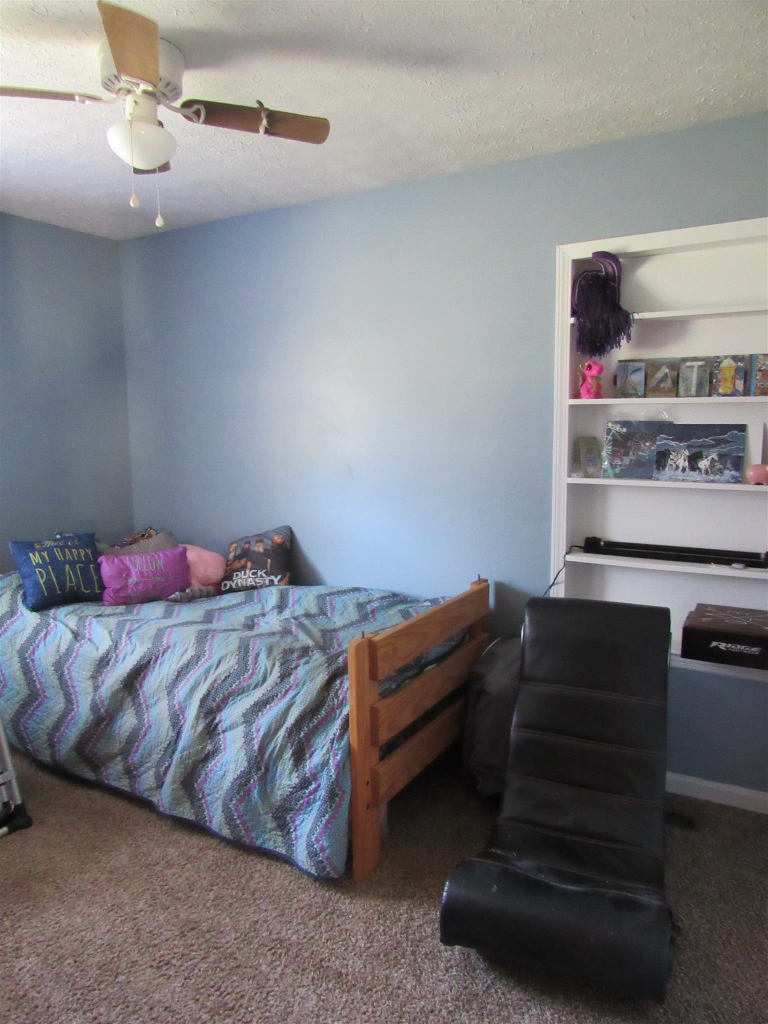 307 Butler Road Portland, TN 37148 - Photo 14 of 21 a bedroom with a bed and cabinets