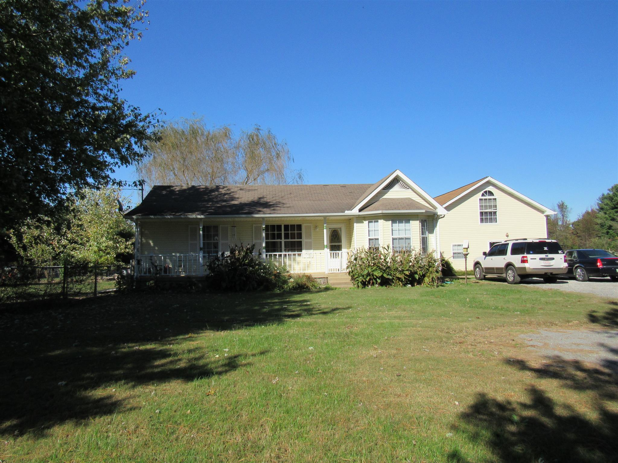 307 Butler Road Portland, TN 37148 - Photo 21 of 21 a front view of a house with a yard and garage