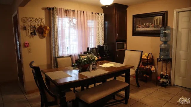 a view of a dining room with furniture and window