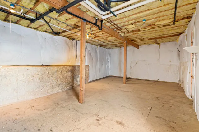 a view of a patio with a table and chairs