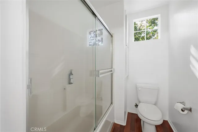 a bed room with a bed and a mirror