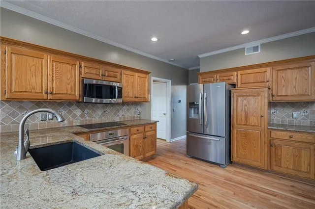 $439,000 | 5805 Northeast Ruby Court, Lee's Summit, MO 64064