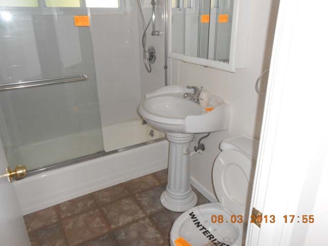 182 West Burlington Street Riverside, IL 60546 - Photo 8 of 11 a bathroom with a sink and mirror