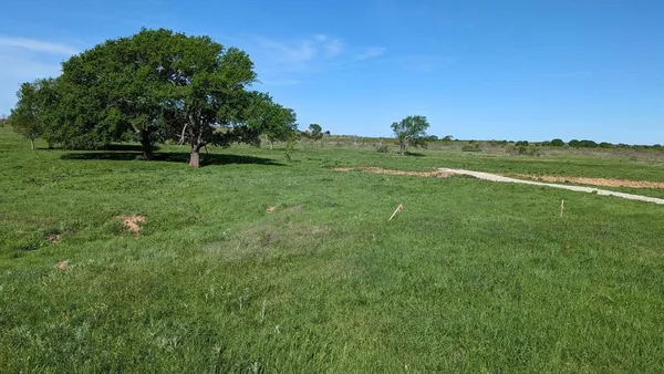 a view of a lake with a yard