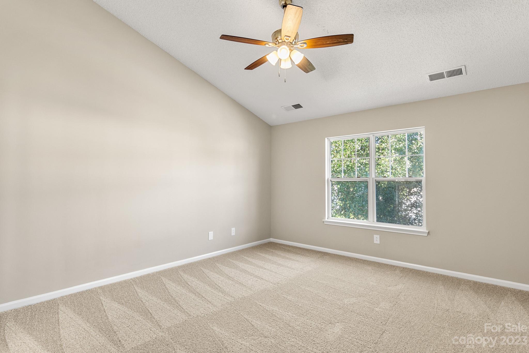 845 Raindrops Road Gastonia, NC 28054 - Photo 23 of 40 an empty room with a window and a fan