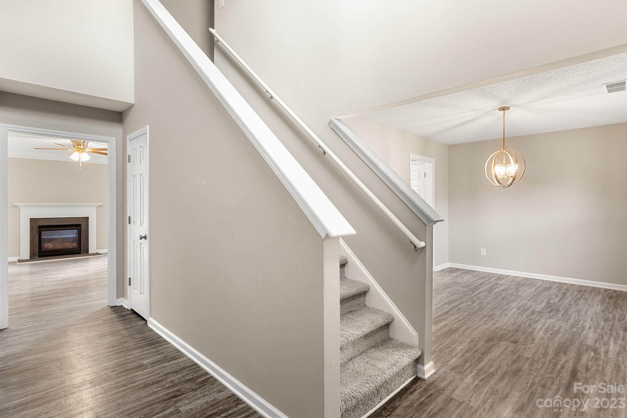 845 Raindrops Road Gastonia, NC 28054 - Photo 6 of 40 a view of entryway and hall with wooden floor