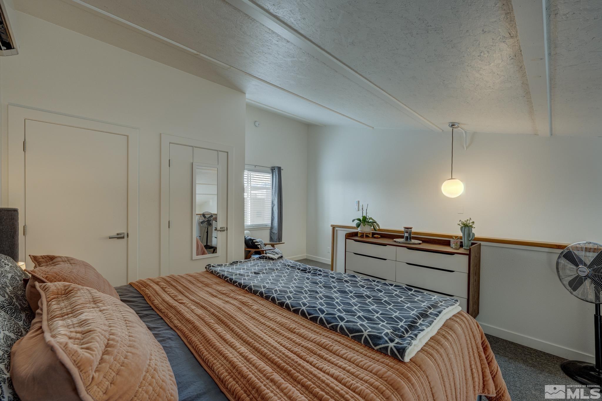 861 Ryland Street Reno, NV 89502 - Photo 29 of 32 a bedroom with a bed and dresser