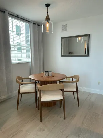 a living room with furniture and windows