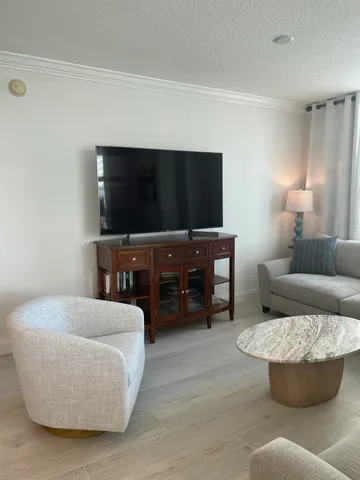 a view of a balcony with wooden floor