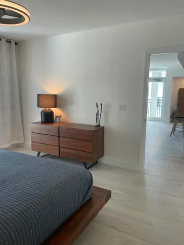 a bathroom with double sink and a mirror