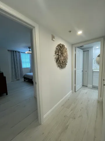 a bathroom with a granite countertop sink a toilet and bathtub