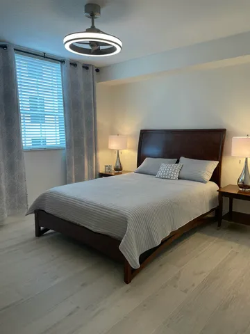 a bedroom with a bed and television