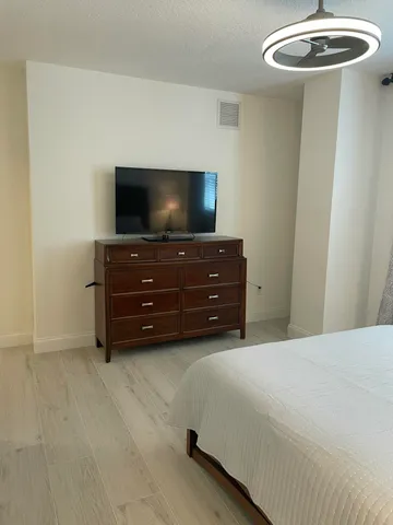 a room with furniture and flat screen tv