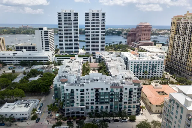 a kitchen with a refrigerator and a sink