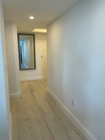 a kitchen with stainless steel appliances granite countertop a refrigerator a stove a sink a microwave and island