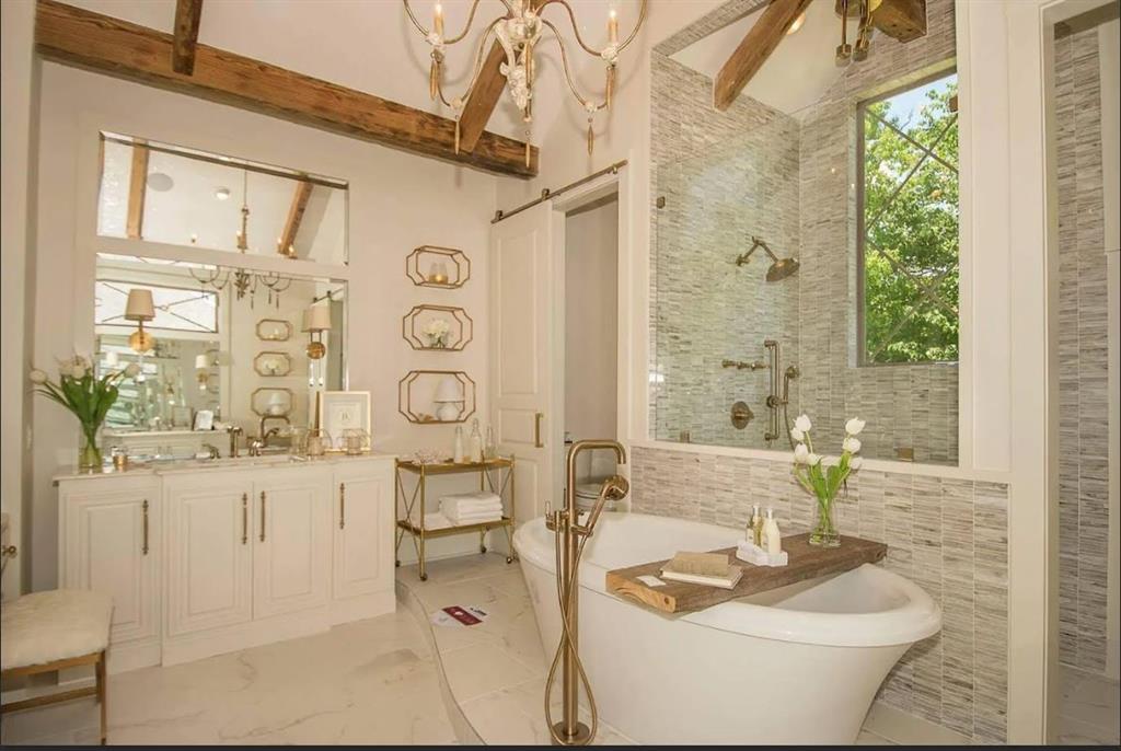 a bathroom with a toilet sink and shower