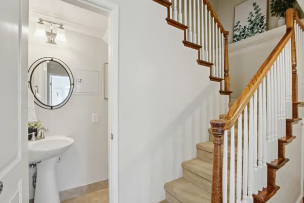 a view of a hallway with wooden floor and entryway