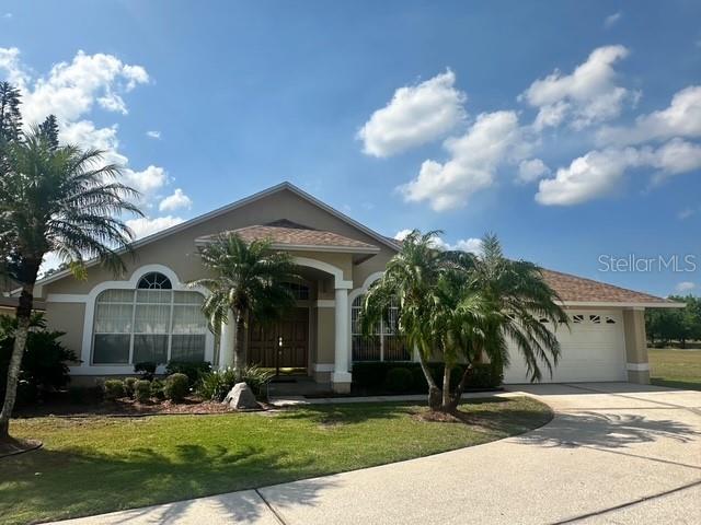 553 Hallowell Circle Orlando, FL 32828 - Photo 1 of 1 a front view of a house with garden