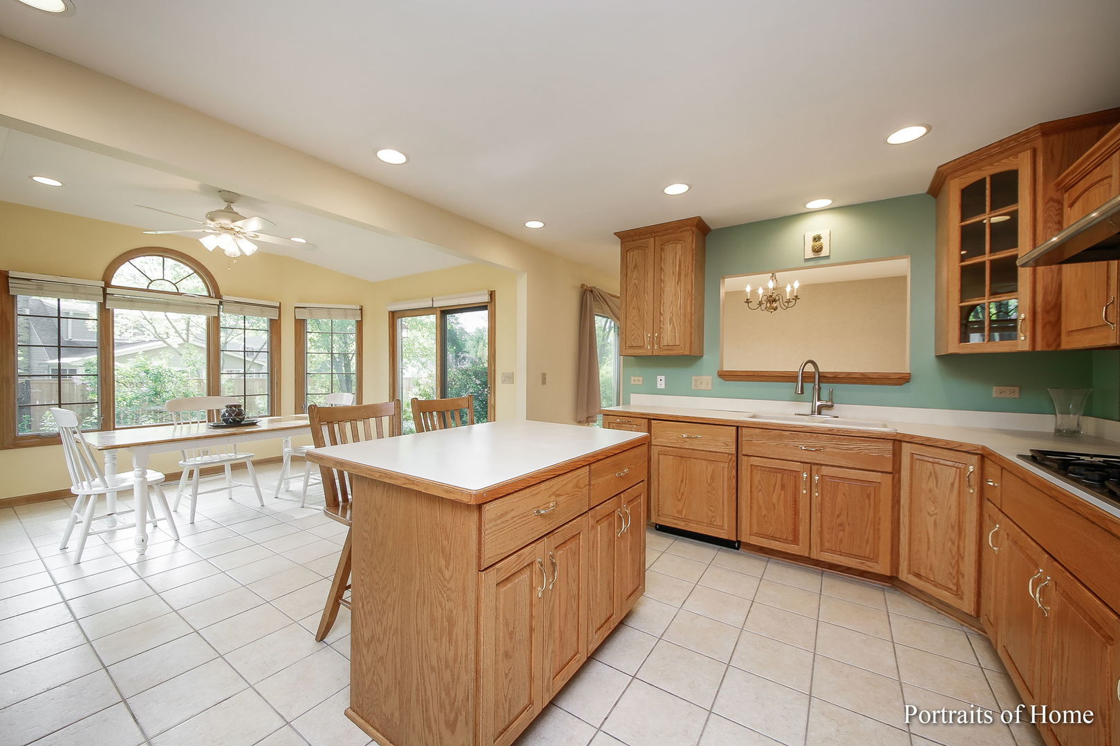 417 South River Road Naperville, IL 60540 - Photo 11 of 27 a kitchen with a sink stove and cabinets