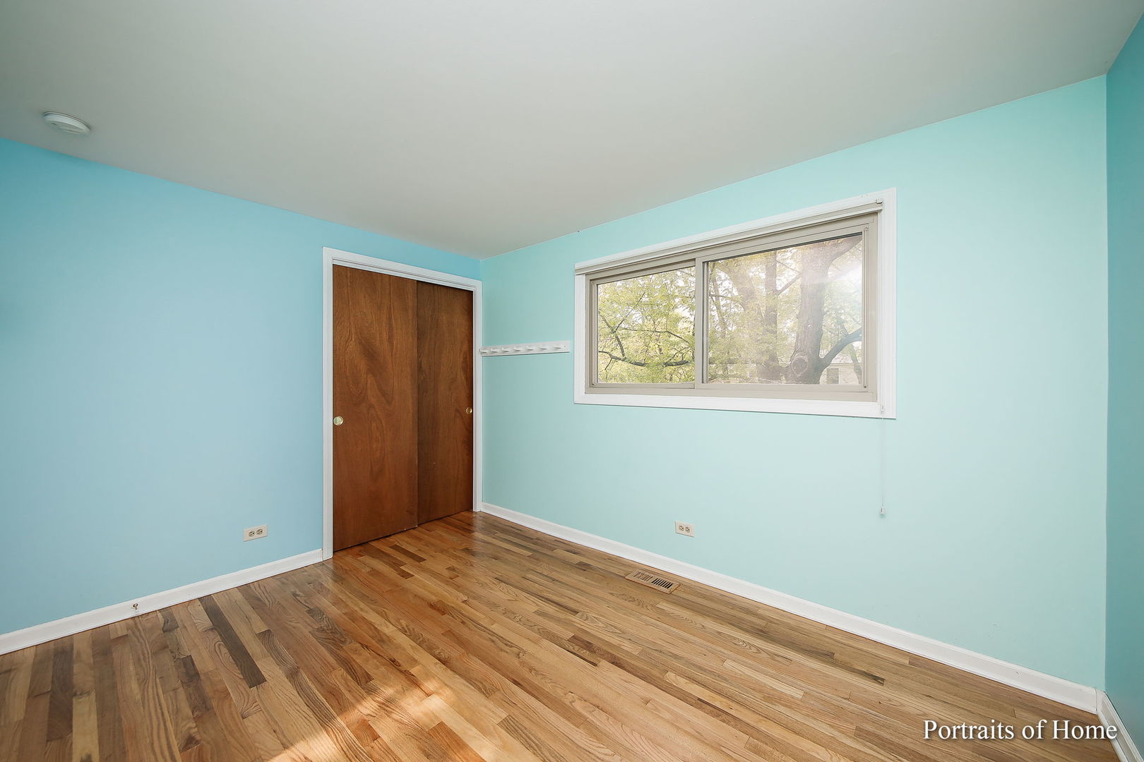 417 South River Road Naperville, IL 60540 - Photo 16 of 27 a view of empty room with wooden floor and fan