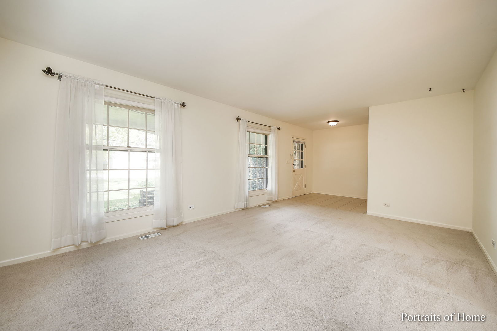 417 South River Road Naperville, IL 60540 - Photo 3 of 27 a view of an empty room with a window