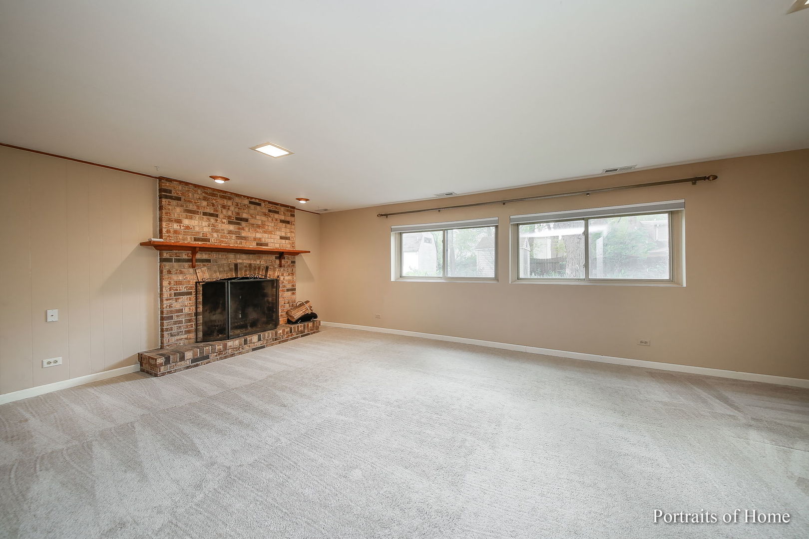 417 South River Road Naperville, IL 60540 - Photo 21 of 27 an empty room with fireplace and windows