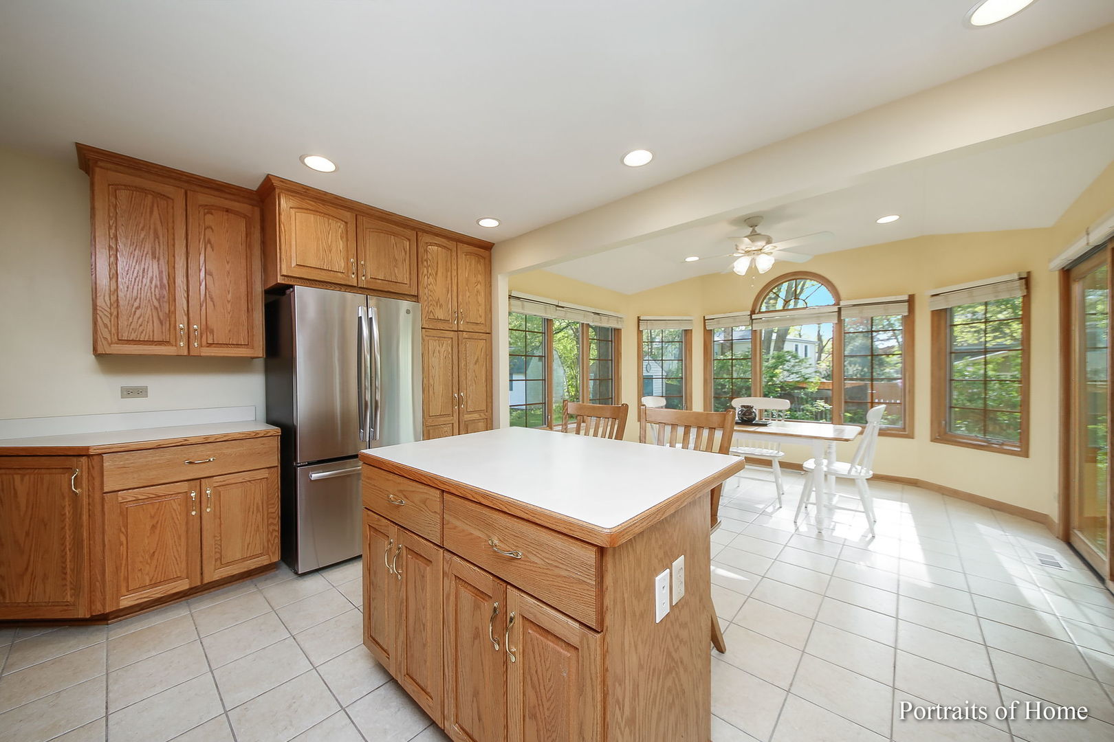 417 South River Road Naperville, IL 60540 - Photo 7 of 27 a large kitchen with stainless steel appliances granite countertop a refrigerator a sink and a large window