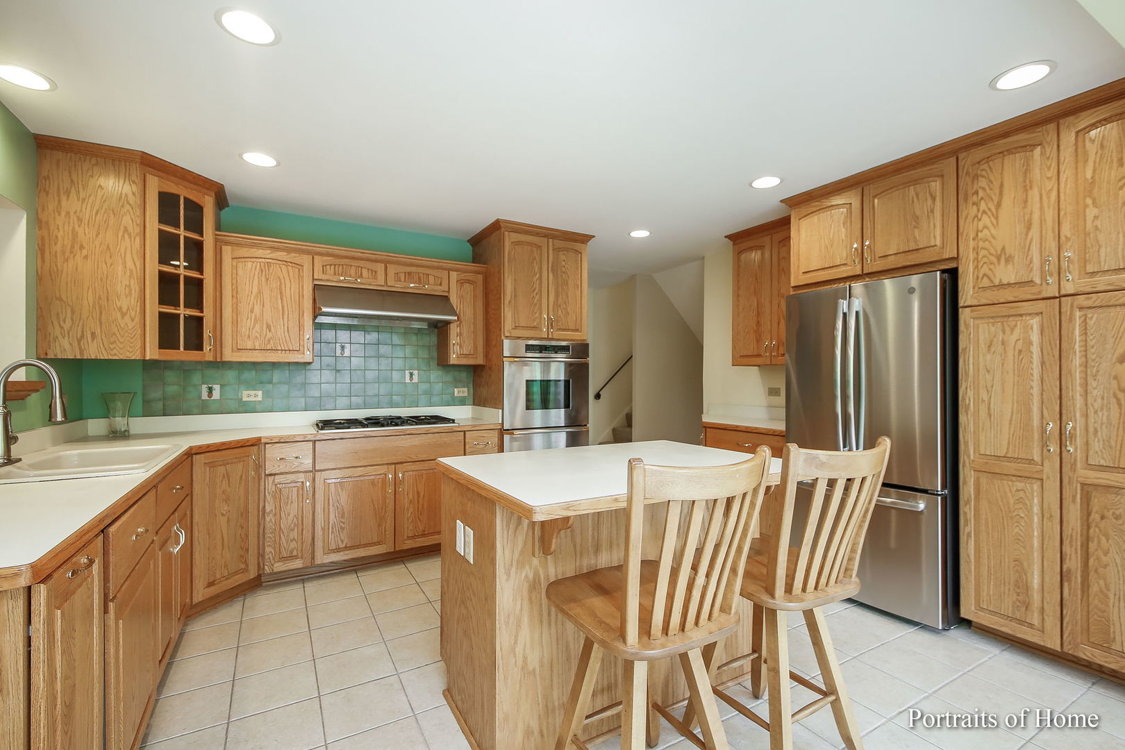 417 South River Road Naperville, IL 60540 - Photo 10 of 27 a kitchen with stainless steel appliances granite countertop a refrigerator and a stove top oven