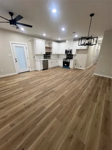a view of a kitchen with a sink and a dishwasher