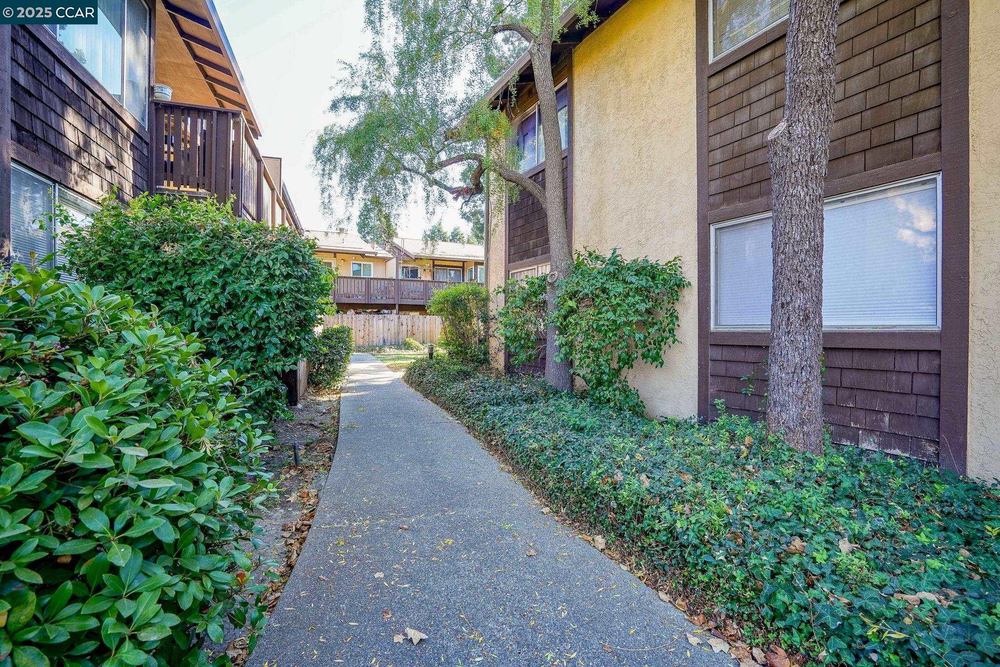 1440 Reganti Place, Unit 11 Concord, CA 94518 - Photo 15 of 15 a view of a pathway both side of house