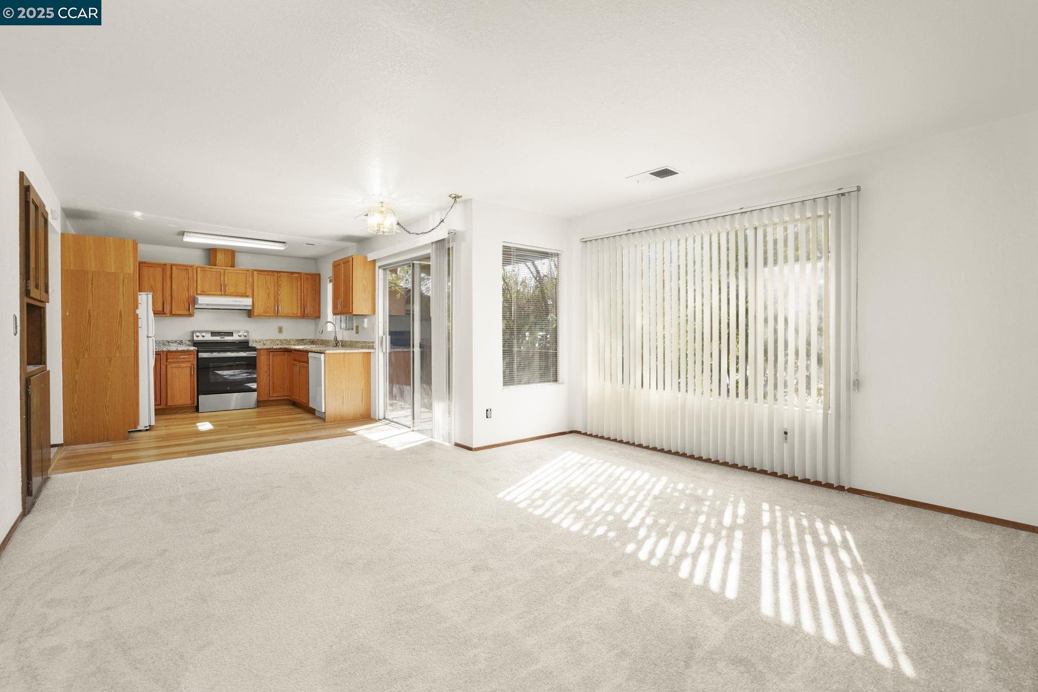 1440 Reganti Place, Unit 11 Concord, CA 94518 - Photo 2 of 15 a view of an empty room with a window