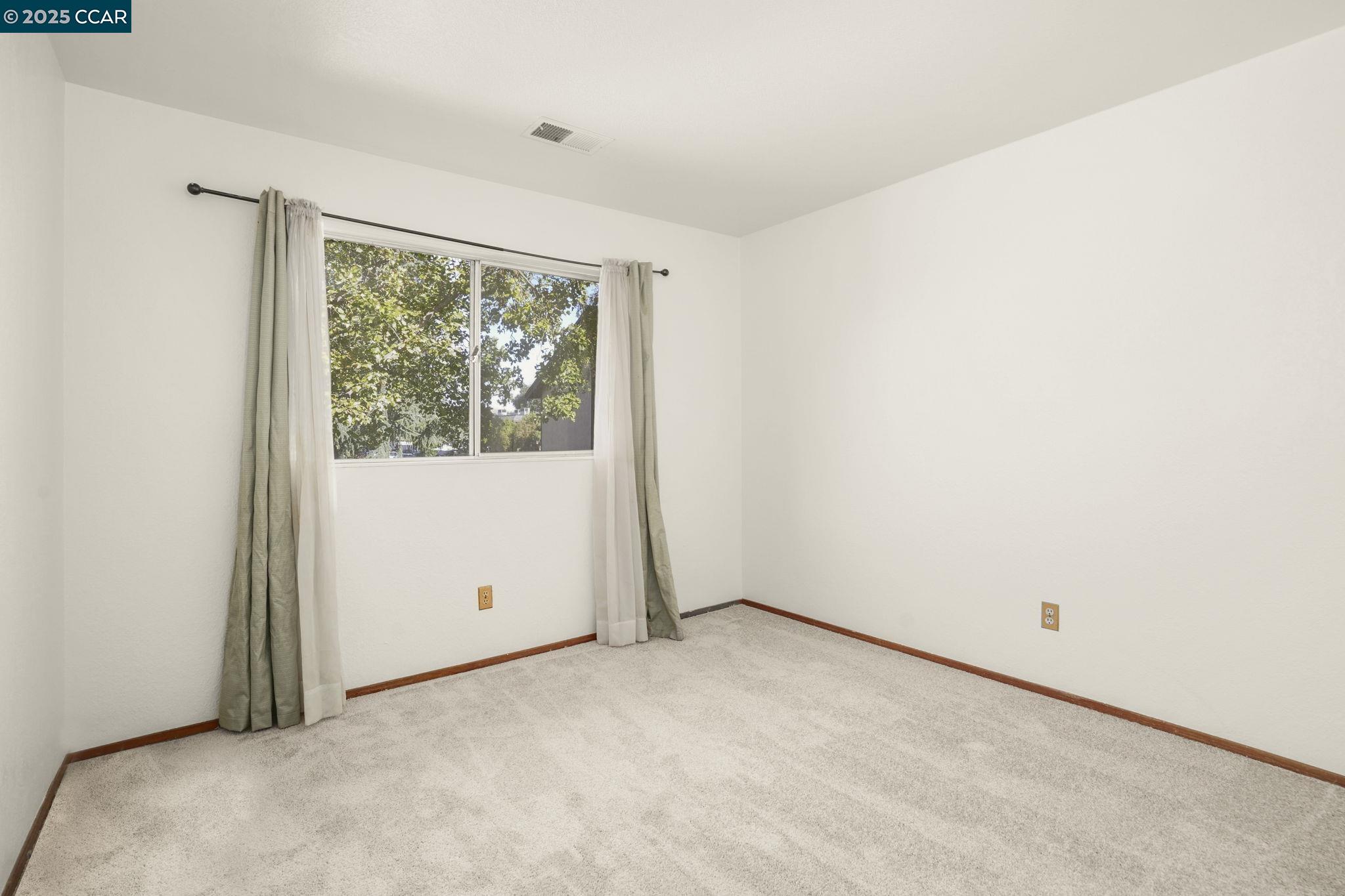 1440 Reganti Place, Unit 11 Concord, CA 94518 - Photo 10 of 15 an empty room with a window