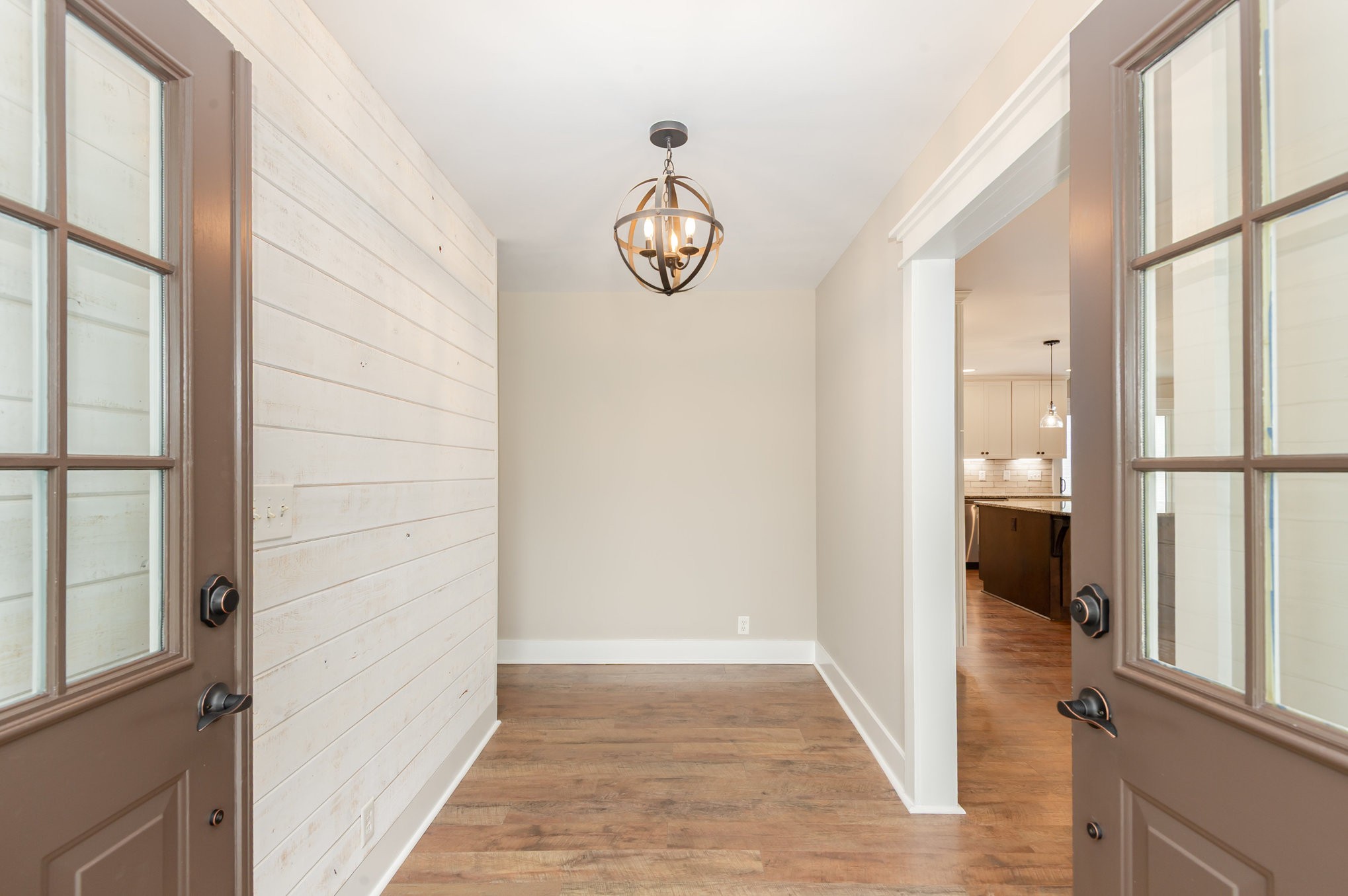 165 Stewart Road Lebanon, TN 37087 - Photo 3 of 26 a view of a hallway with wooden floor and a dining room