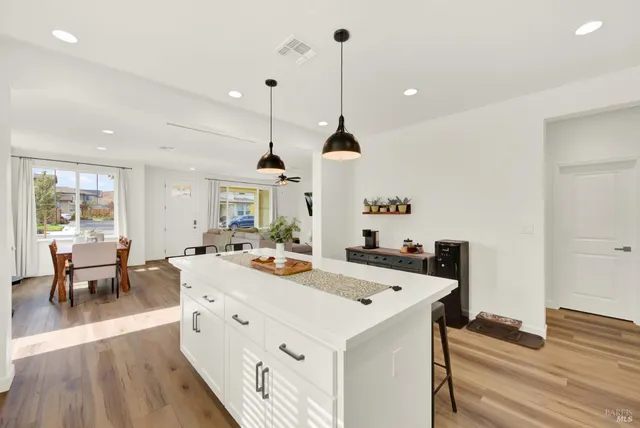 a bathroom with a sink mirror and toilet