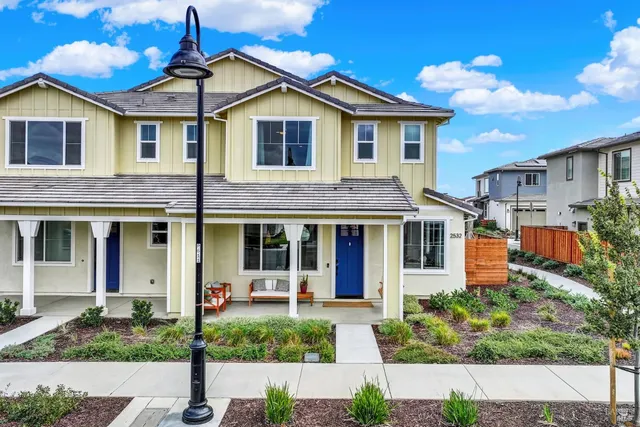 a front view of a house with a yard