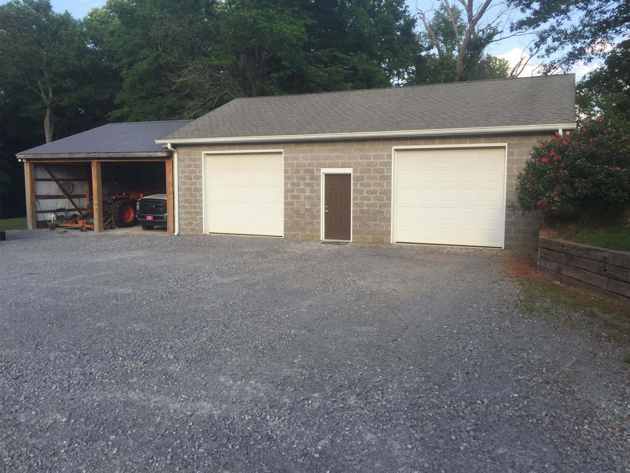 3707 Edd Ross Road Cedar Hill, TN 37032 - Photo 11 of 30 a view of a house with a yard and garage