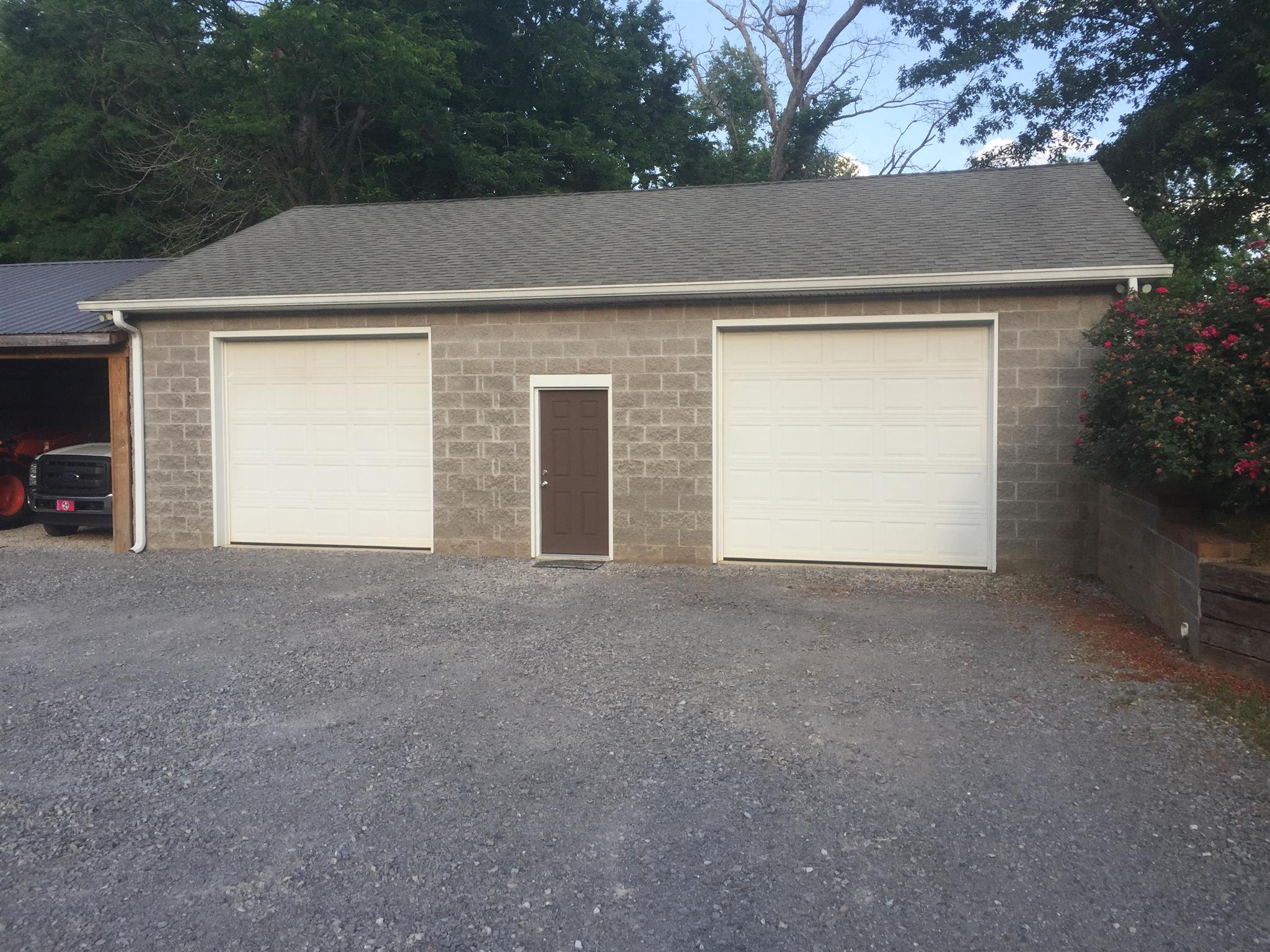 3707 Edd Ross Road Cedar Hill, TN 37032 - Photo 12 of 30 a front view of a house with a yard and garage