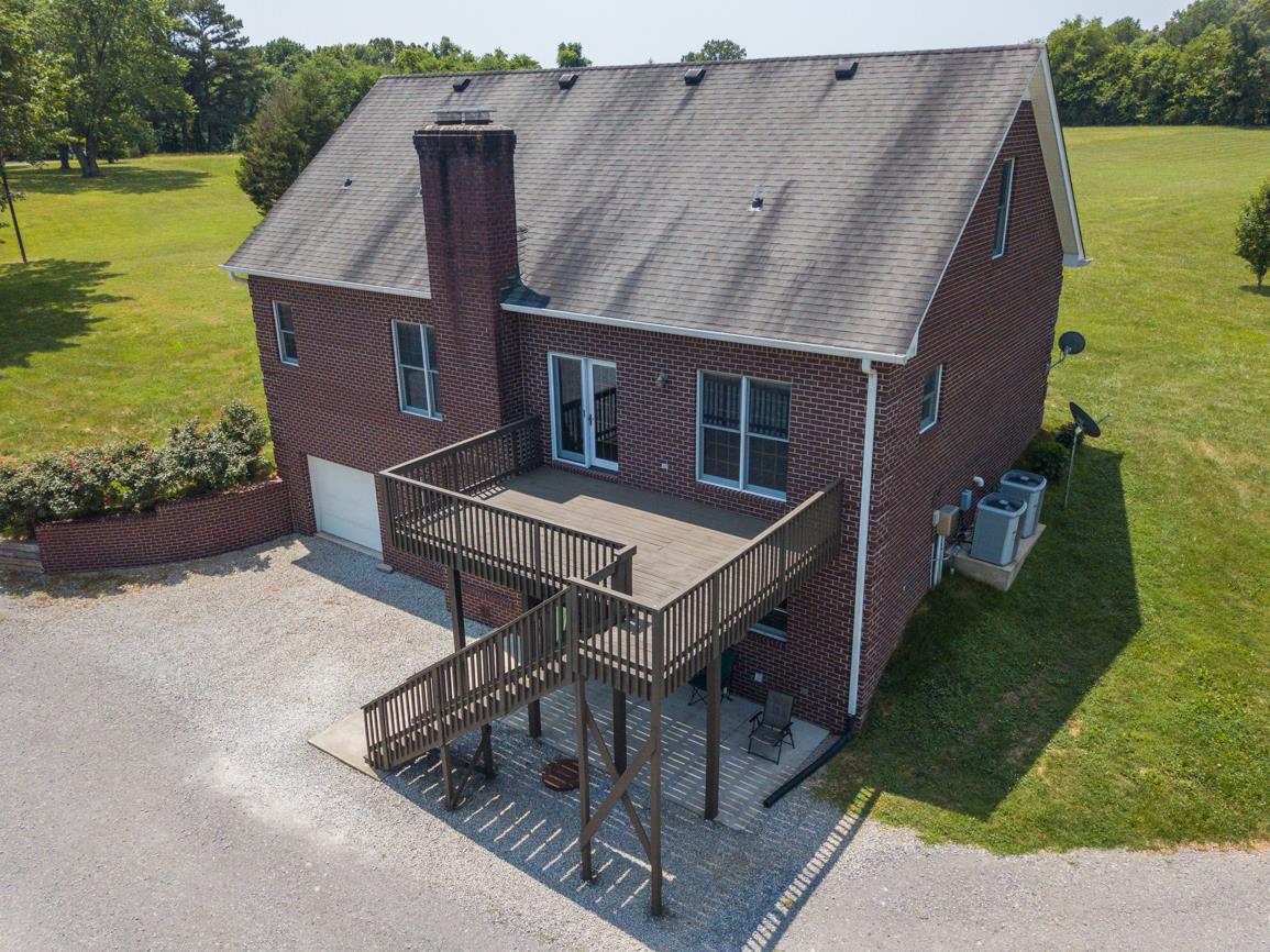 3707 Edd Ross Road Cedar Hill, TN 37032 - Photo 27 of 30 a aerial view of a house with swimming pool and garden