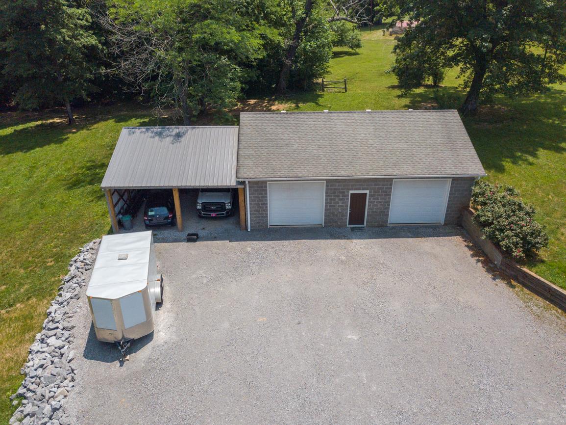 3707 Edd Ross Road Cedar Hill, TN 37032 - Photo 6 of 30 an aerial view of a house with a yard and garage